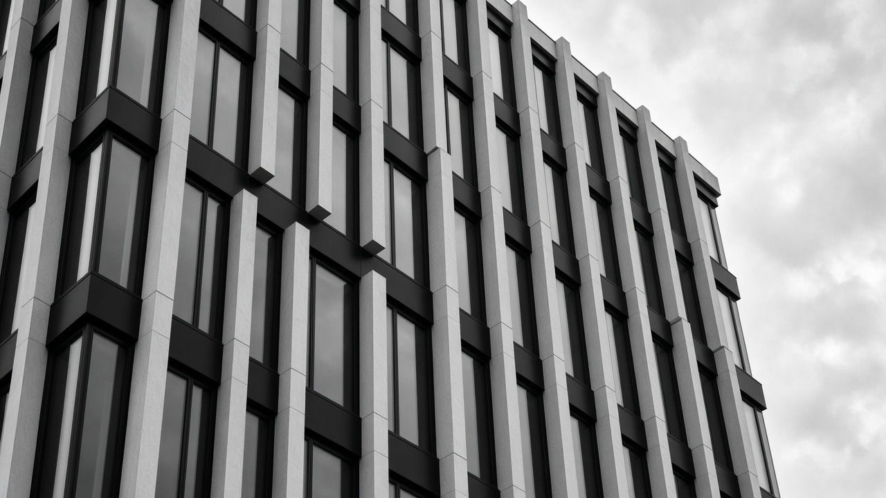 Black-and-white facade of a modern commercial office building